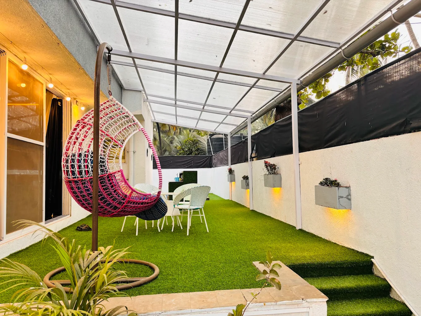 Glass House Luxury Villa illuminated at dusk